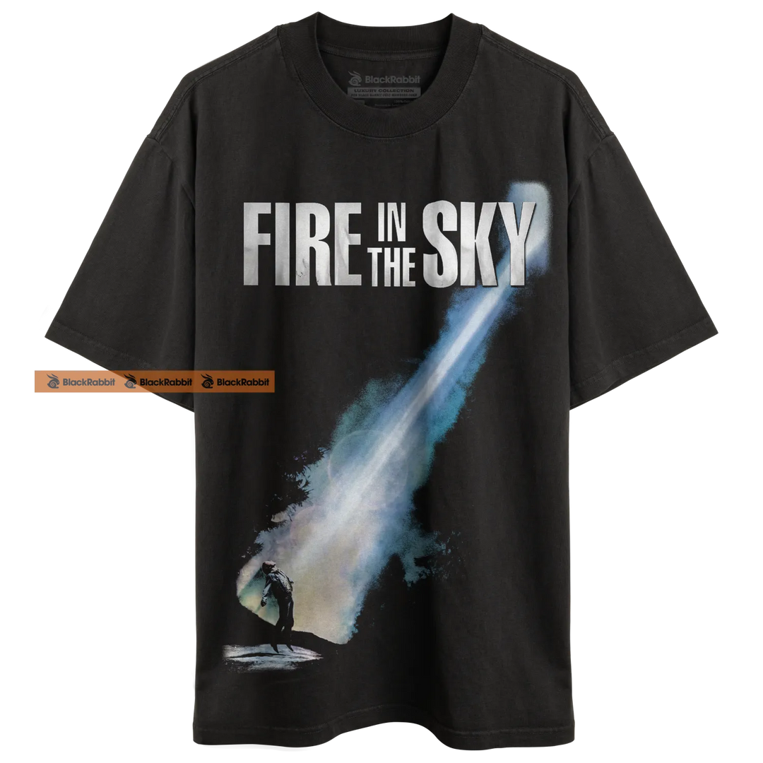 Black t-shirt with ’Fire in the Sky’ graphic.