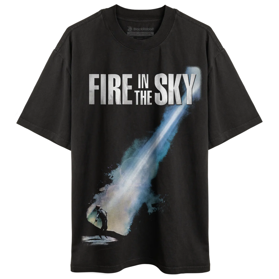 Dark gray t-shirt with a graphic of a person looking at a bright, streaking light.