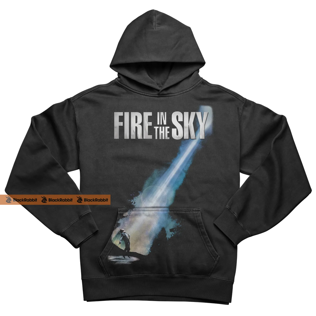 Black hoodie with ’Fire in the Sky’ graphic.