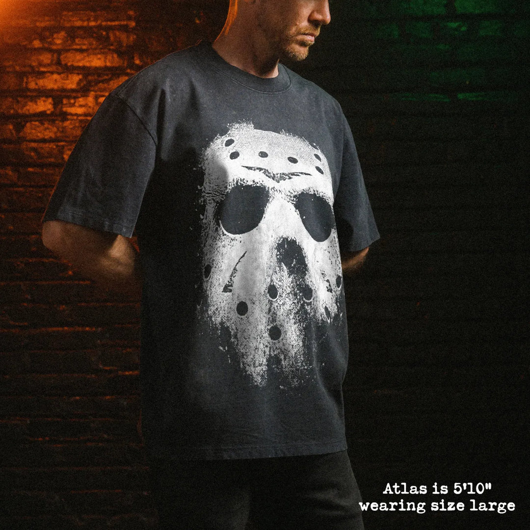Male model wearing stone wash heavy tee with jason mask graphic 