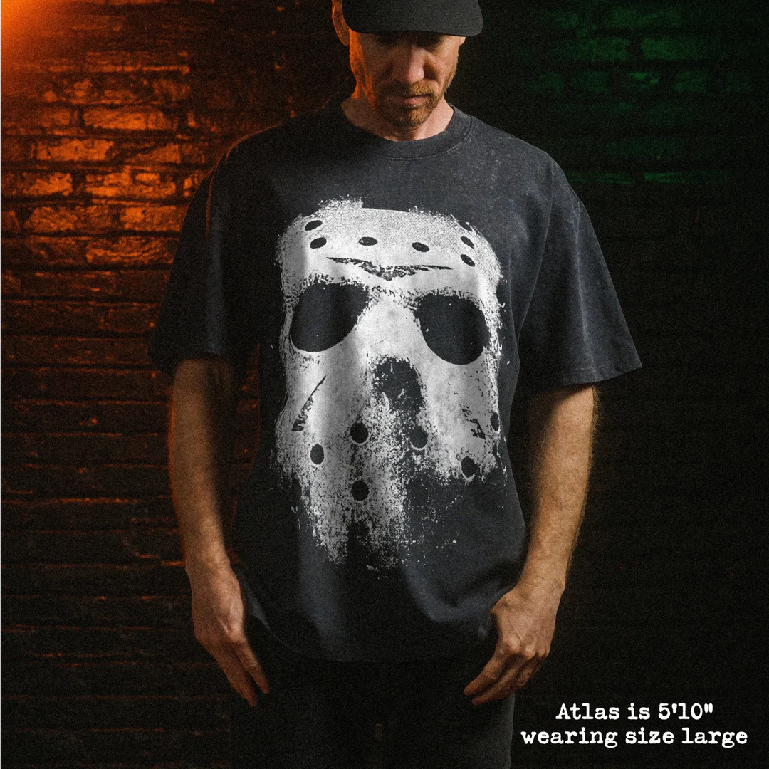 Male model wearing stone wash heavy tee with jason mask graphic 