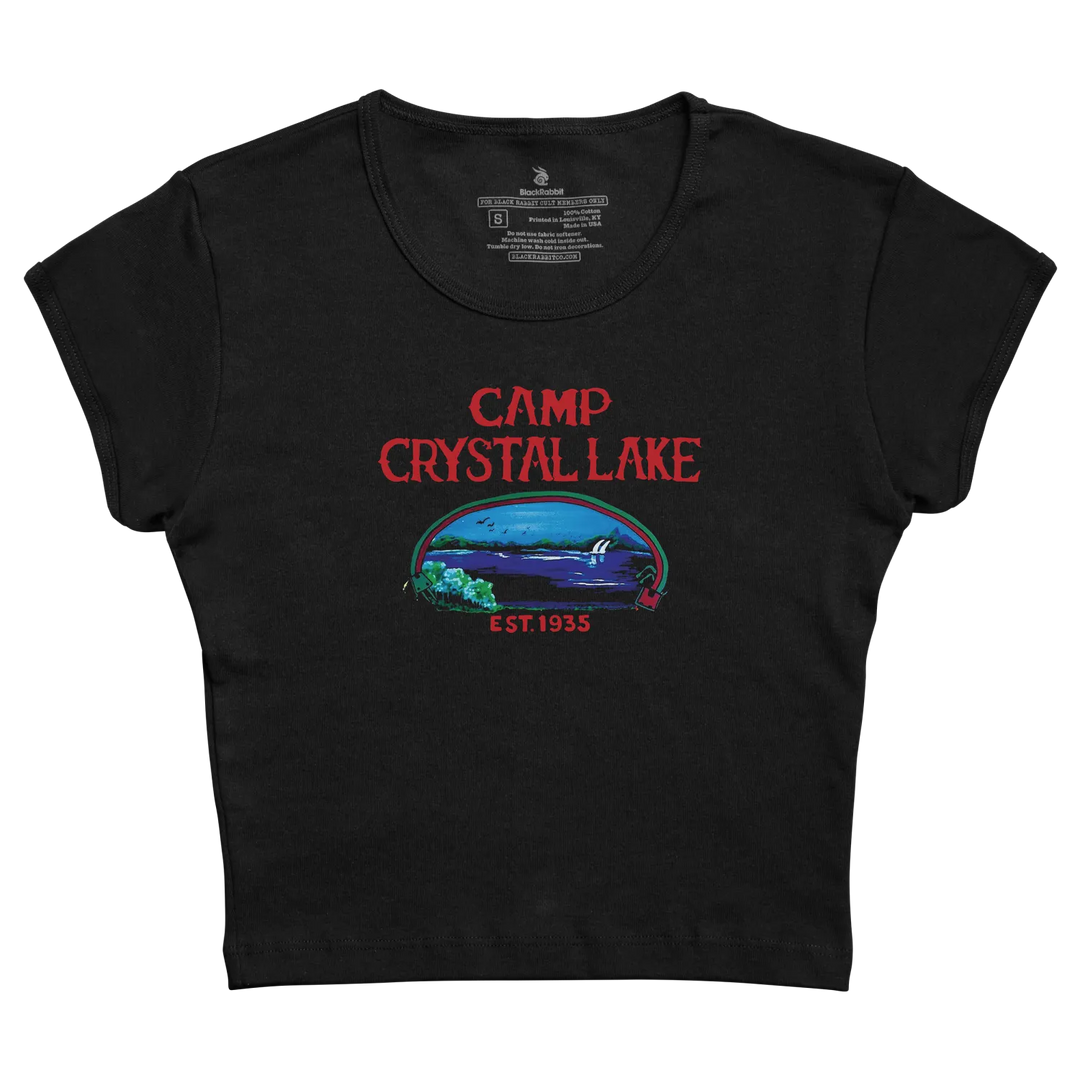 Black cropped t-shirt featuring a red ’camp crystal lake’ graphic with an illustrated lake scene and ’est.