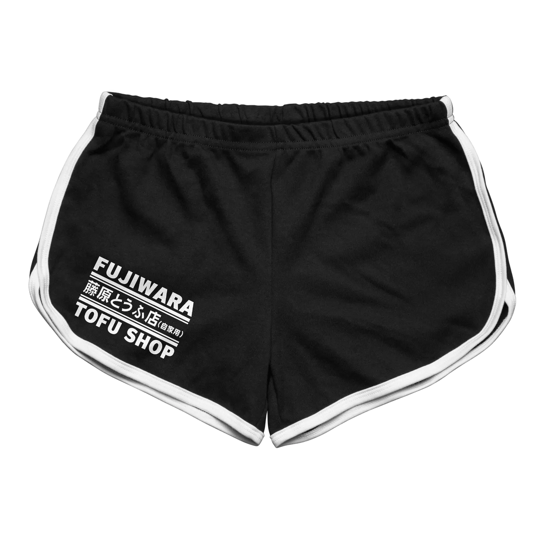 Black athletic shorts with white side stripes and a printed logo on the left leg.