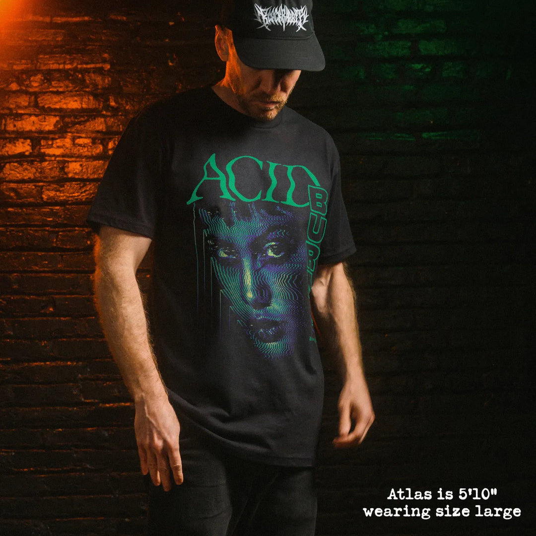 Male model wearing black premium tee with acid burn graphic 