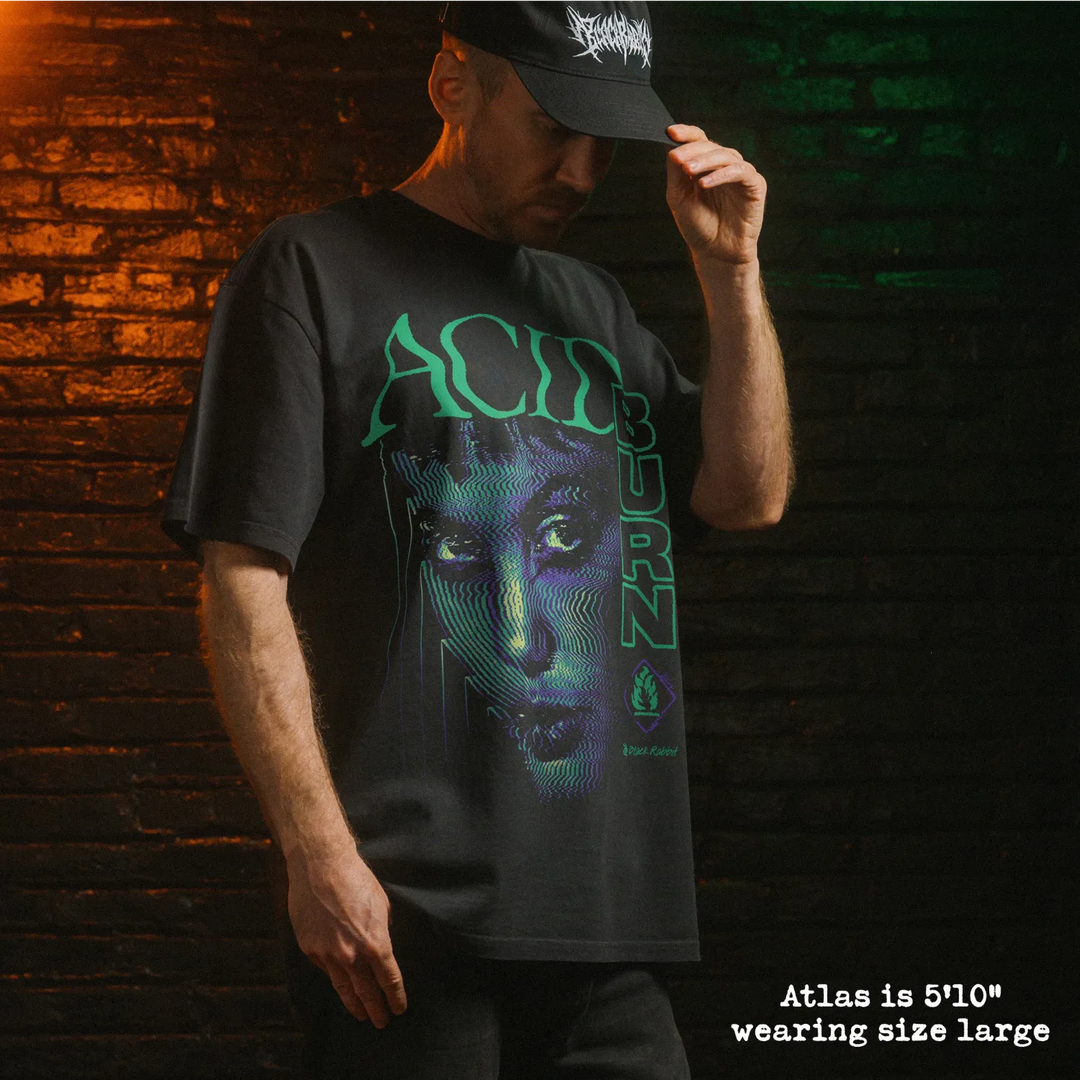 Model wearing heavy tee with acid burn graphic 