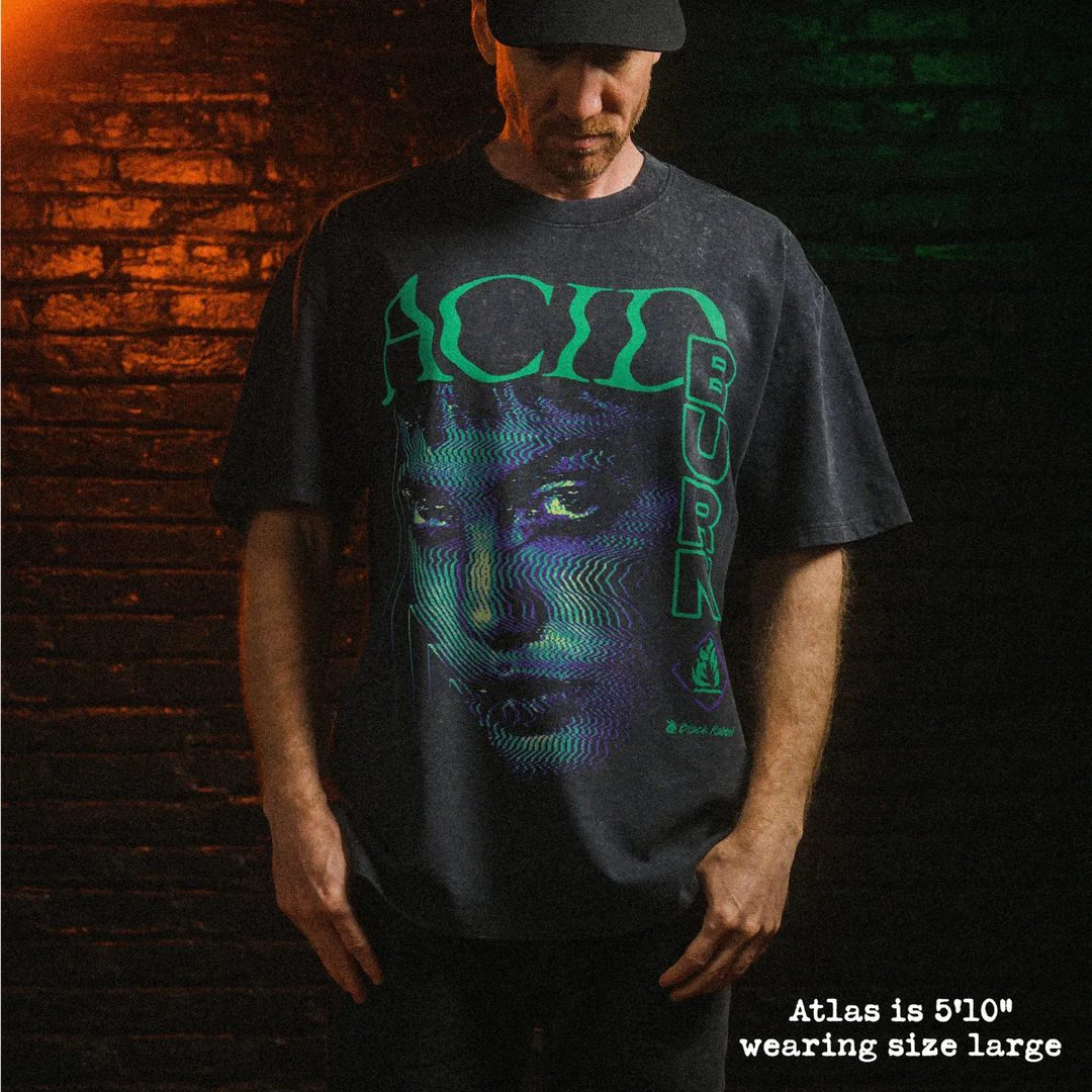 Male model wearing stone wash heavy tee with acid burn graphic 