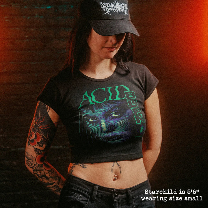 Female model wearing cropped baby tee with Acid Burn graphic
