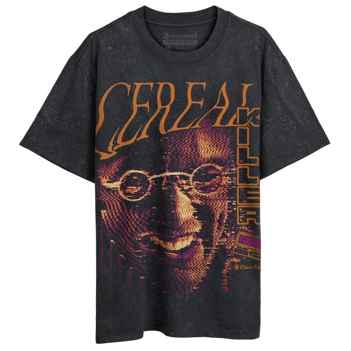Stonewash black oversized T-shirt with large Cereal Killer graphic, orange lettering, purple halftone face artwork, and faded vintage finish. 