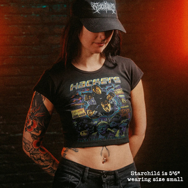 Female model wearing cropped baby tee with hackers graphic

