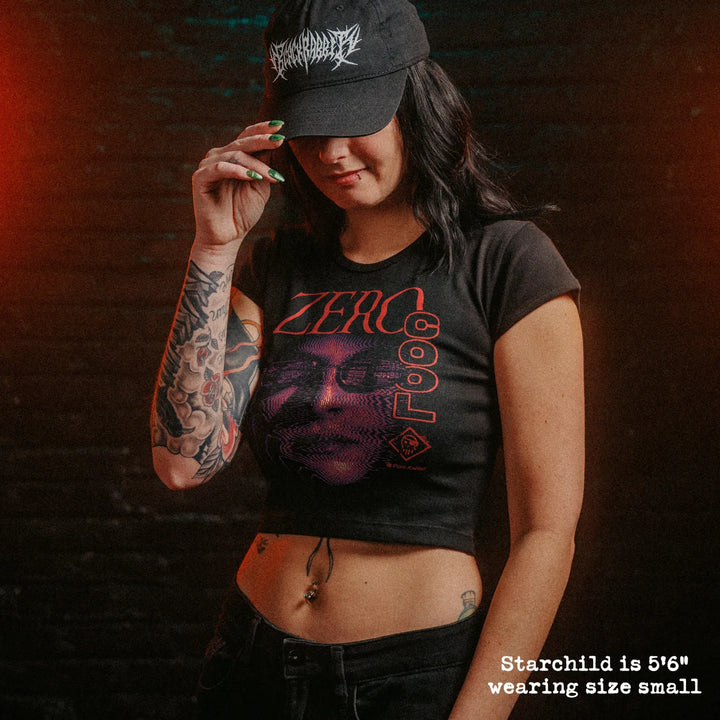 Model wearing cropped baby tee with zero cool graphic.
