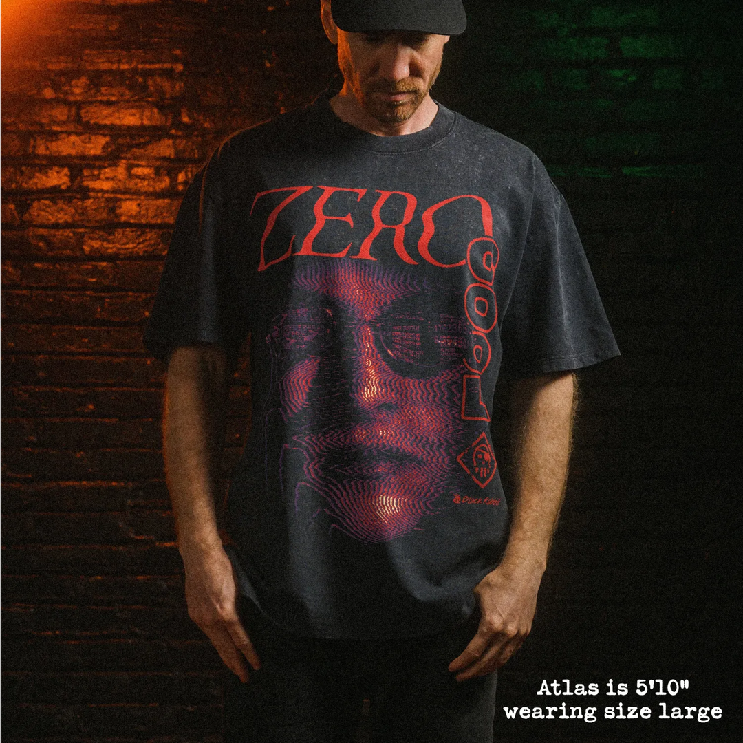Male model wearing stone washed heavy tee with zero cool graphic.
