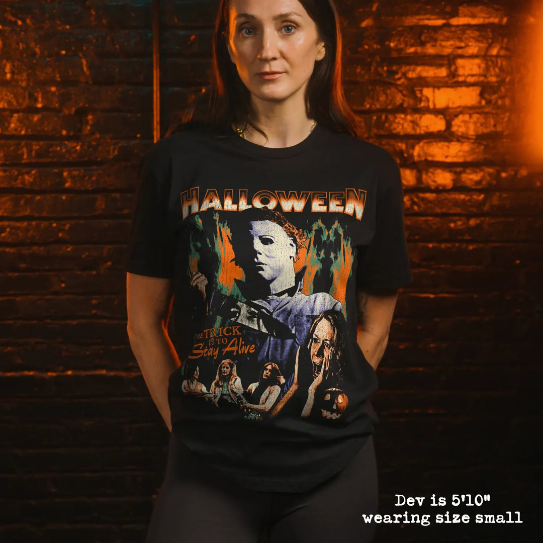 model wearing black premium tee with halloween graphic 