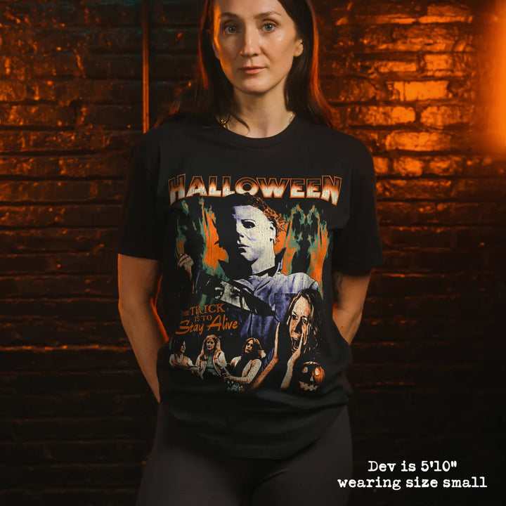 model wearing black premium tee with halloween graphic 