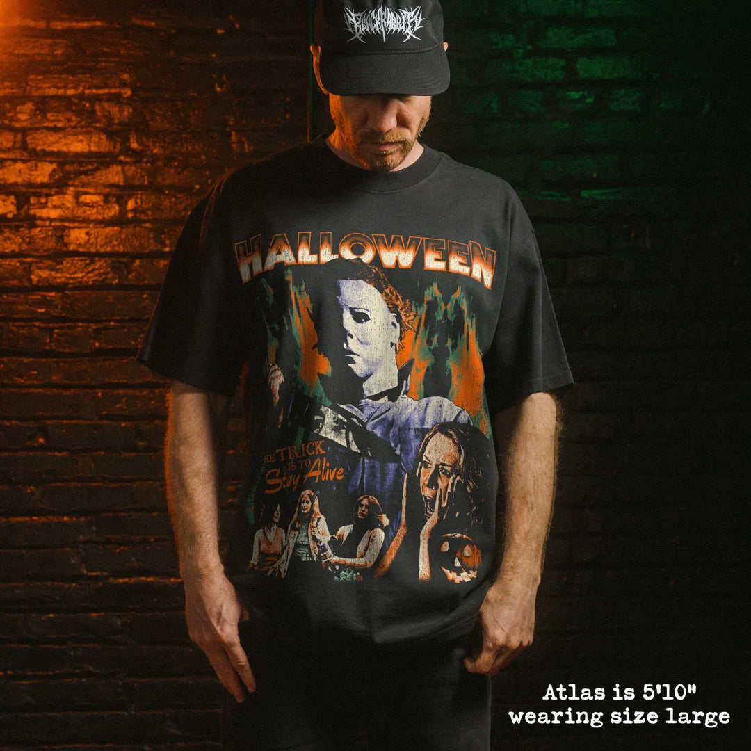 Model wearing heavy tee with halloween graphic 