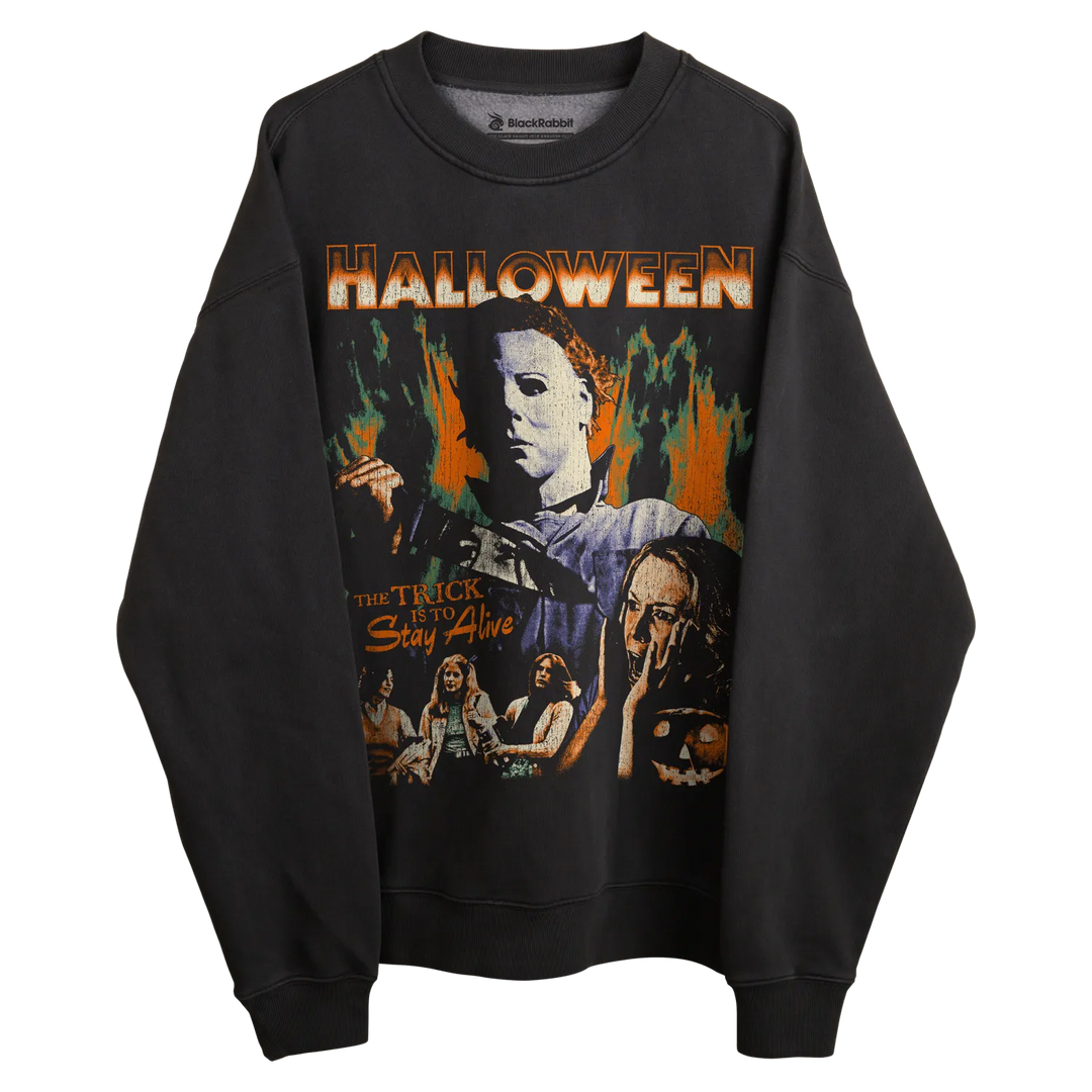 Black michael myers halloween sweatshirt with flame design and ’halloween’ text.