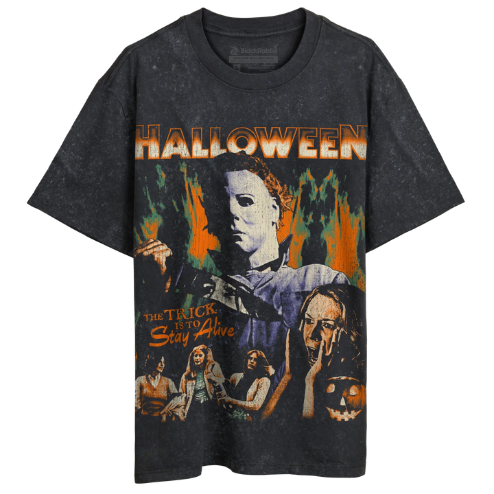 A dark gray, short-sleeved t-shirt with a vintage-style graphic print featuring Michael Myers from the movie ’Halloween’ and the text ’THE TRICK IS TO Stay Alive.’