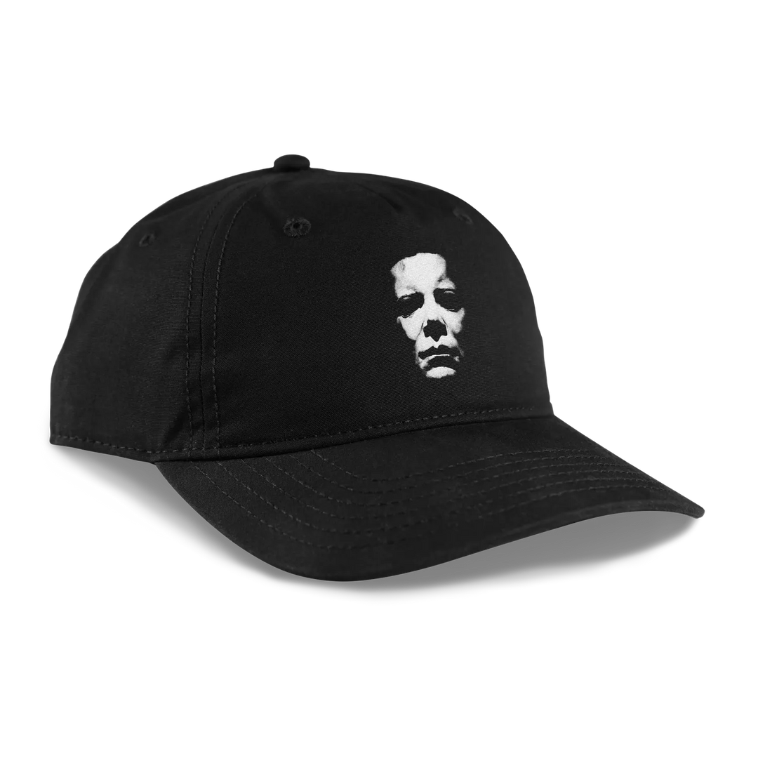 Black unstructured Dad Hat featuring white distressed Michael Myers mask graphic