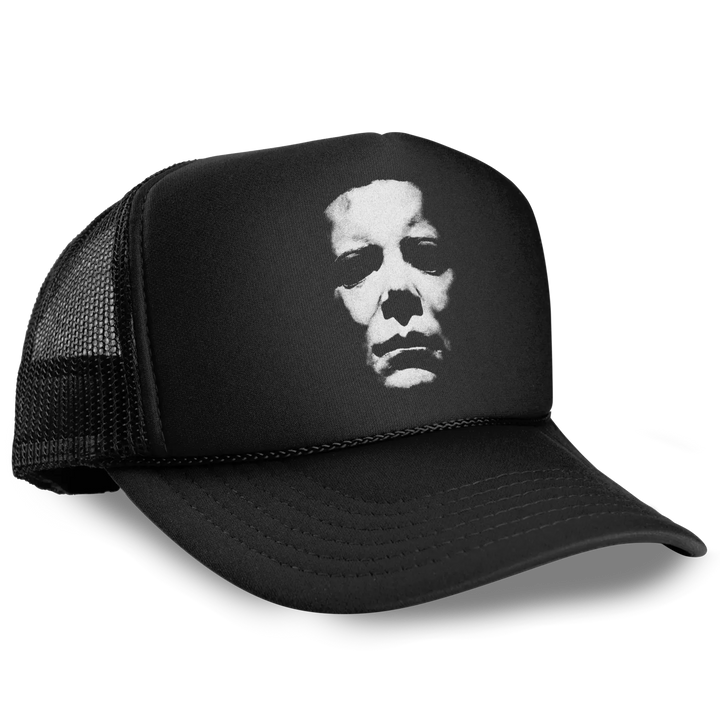 Black Foam Front Trucker Hat featuring white distressed Michael Myers mask graphic