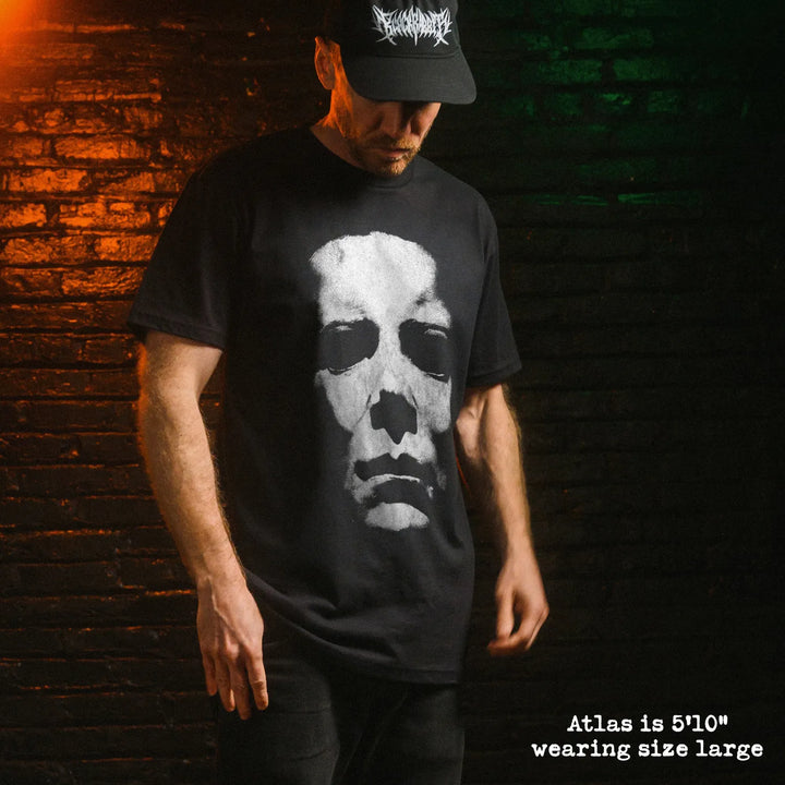 Male model wear soft premium tee with michael myers mask graphic
