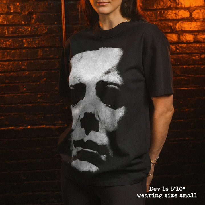 Model wearing heavy tee with michael myers mask graphic 