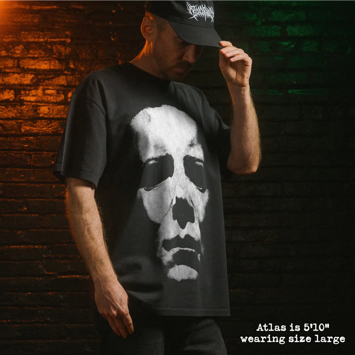 Model wearing heavy tee with michael myers mask graphic 