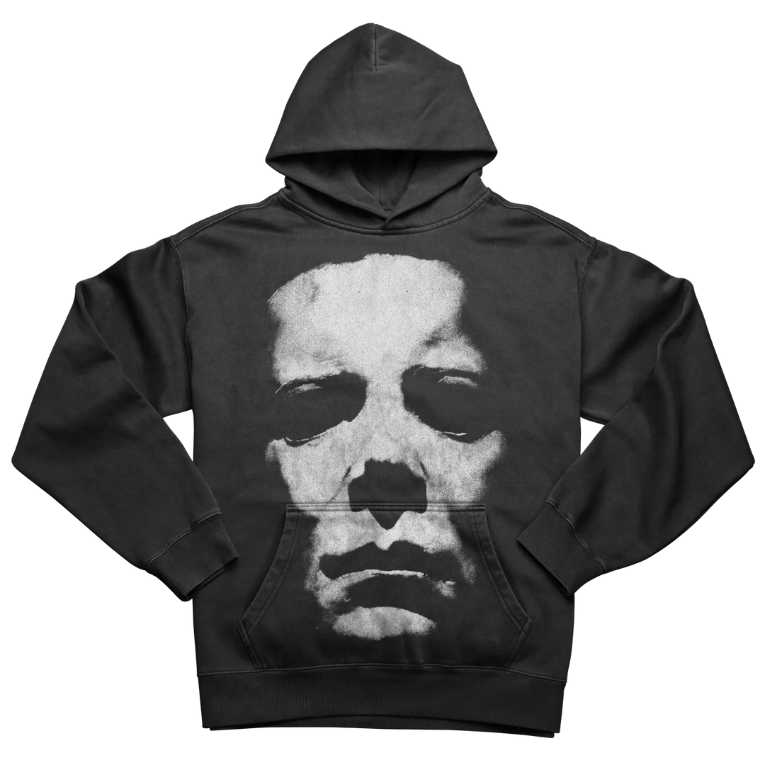 A black hoodie with a white, distressed graphic of a skeletal face.