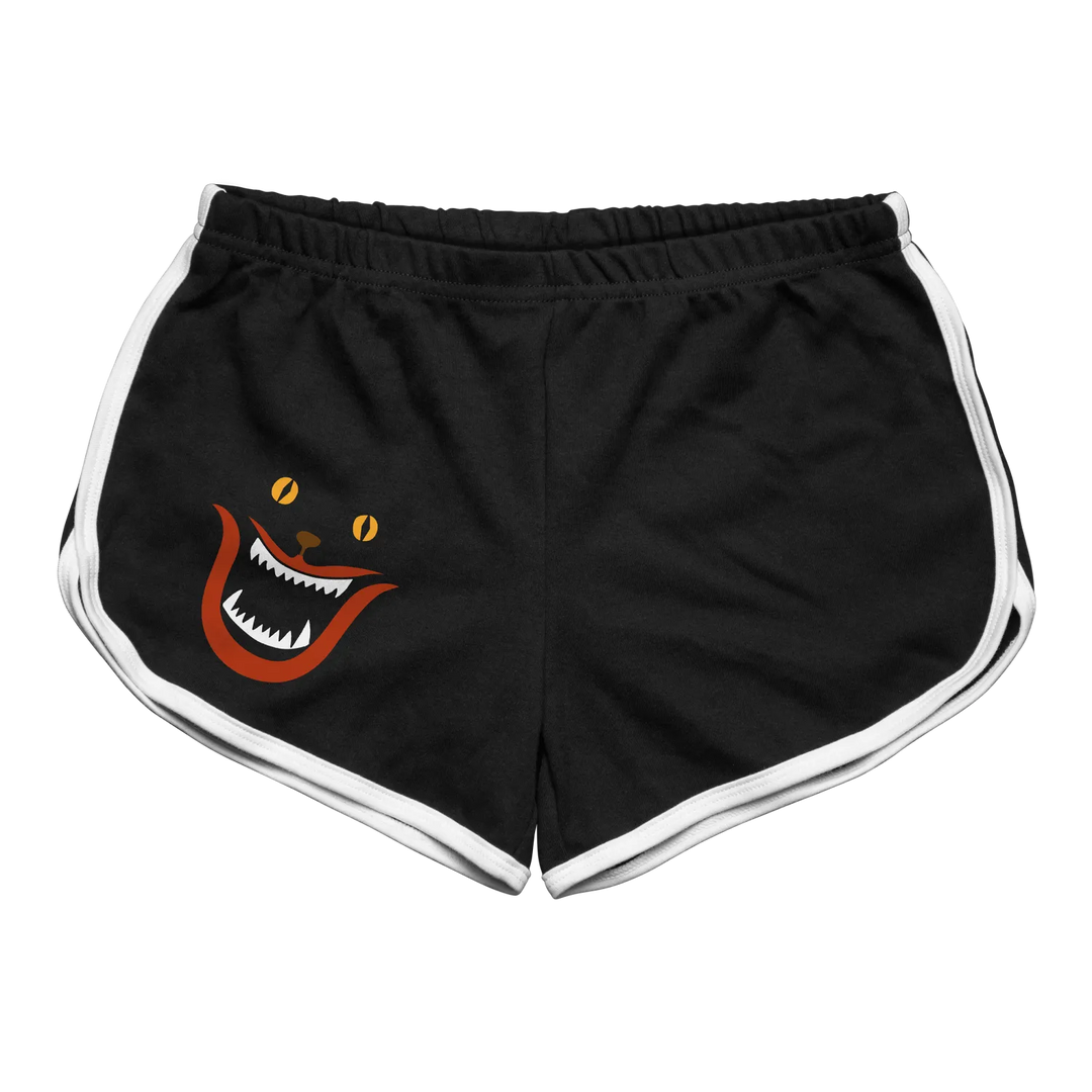 Hausu aka house blanche cat face women’s retro sport shorts in black with white trim and orange cat graphic on right leg