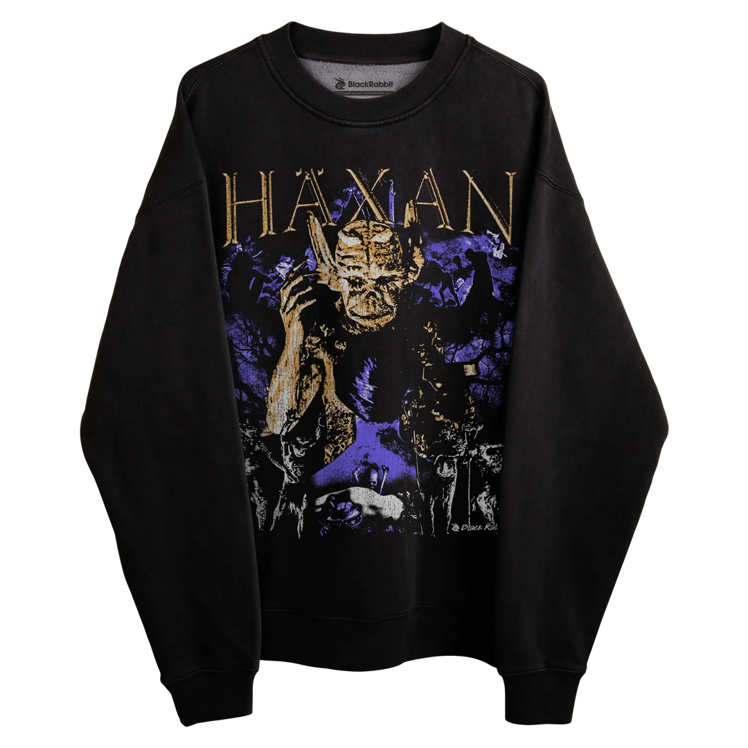 Black sweatshirt with gold and purple graphic design featuring a skull.