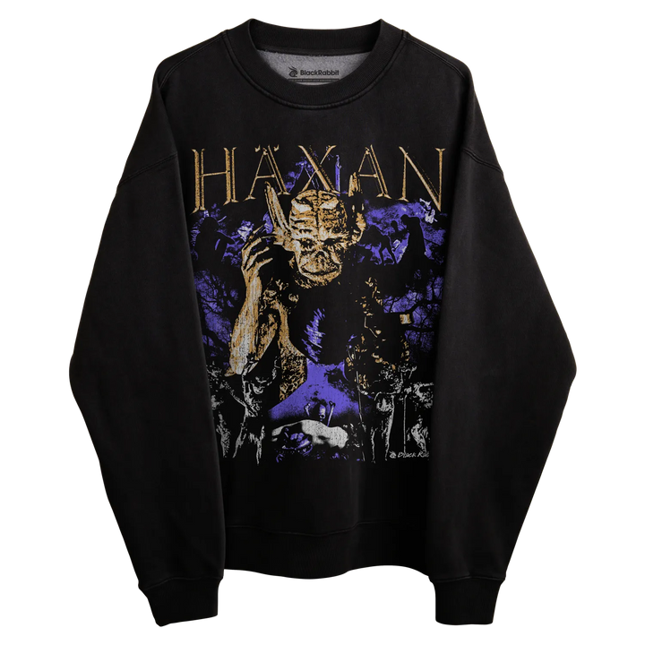 Black sweatshirt with gold and purple graphic design featuring a skull.