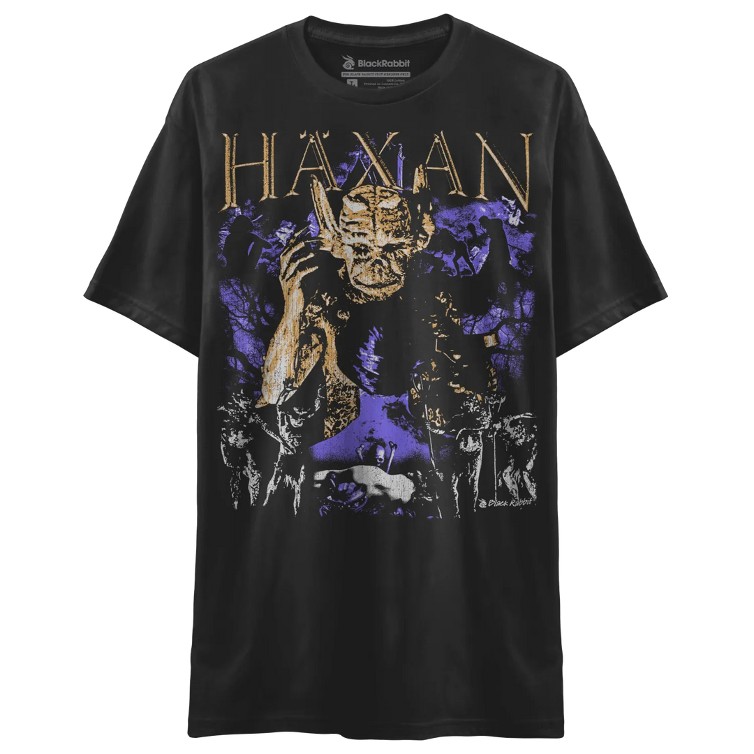 Black short-sleeved t-shirt with a purple and gold graphic print of a demonic figure.