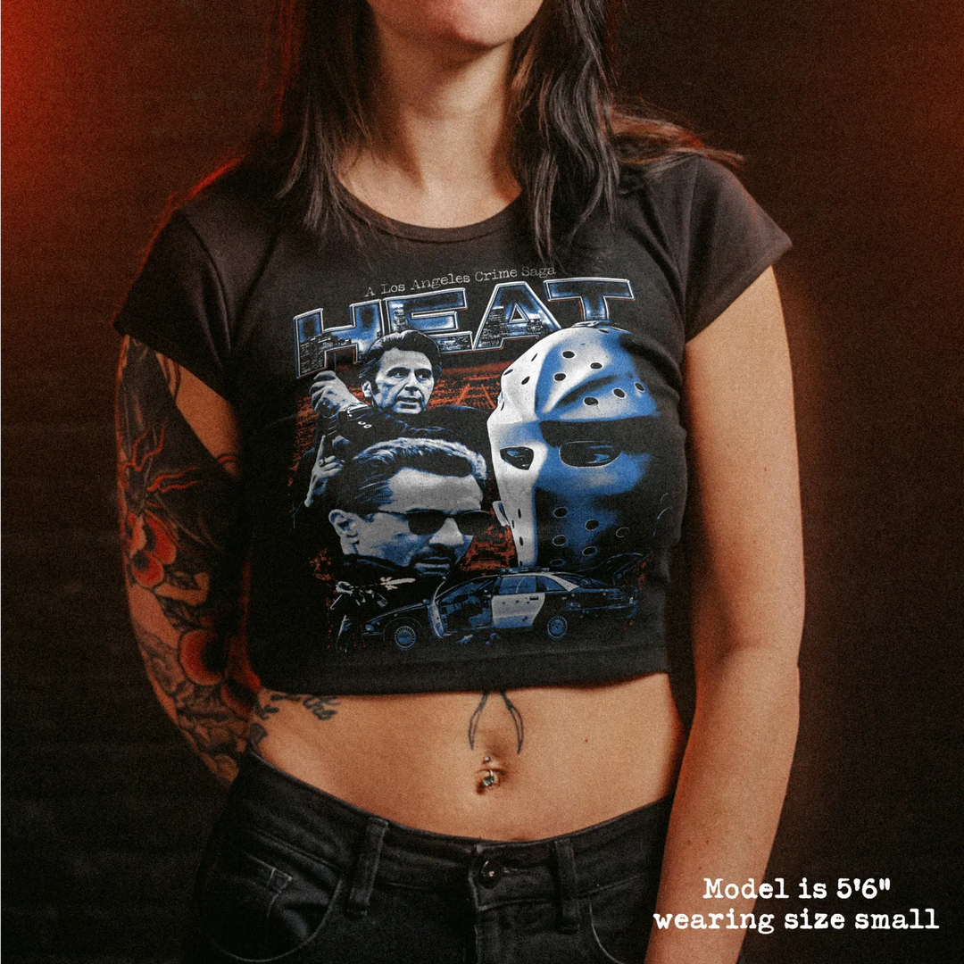 Female model wearing cropped baby tee with heat graphic
