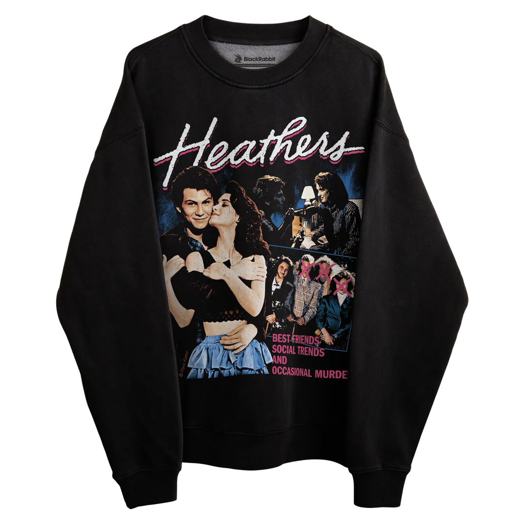 Black sweatshirt with ’heathers’ graphic design featuring characters and title in white, red, blue, yellow, green, purple.