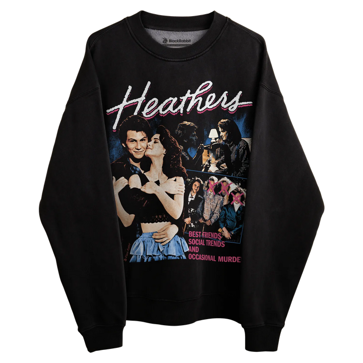Black sweatshirt with ’heathers’ graphic design featuring characters and title in white, red, blue, yellow, green, purple.