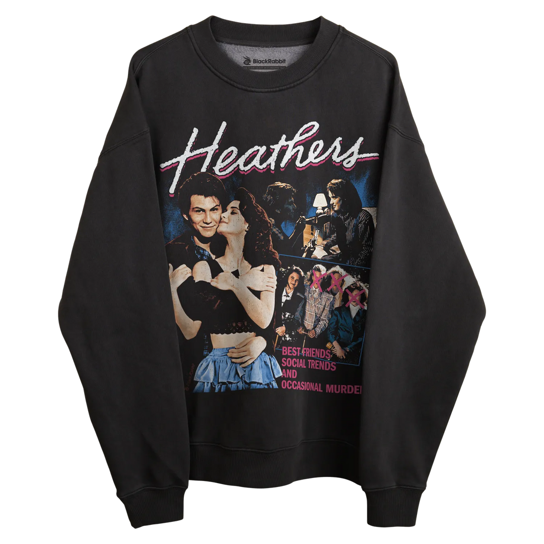 Black sweatshirt with ’heathers’ graphic design featuring characters and title in white, pink, blue, yellow, green, red.
