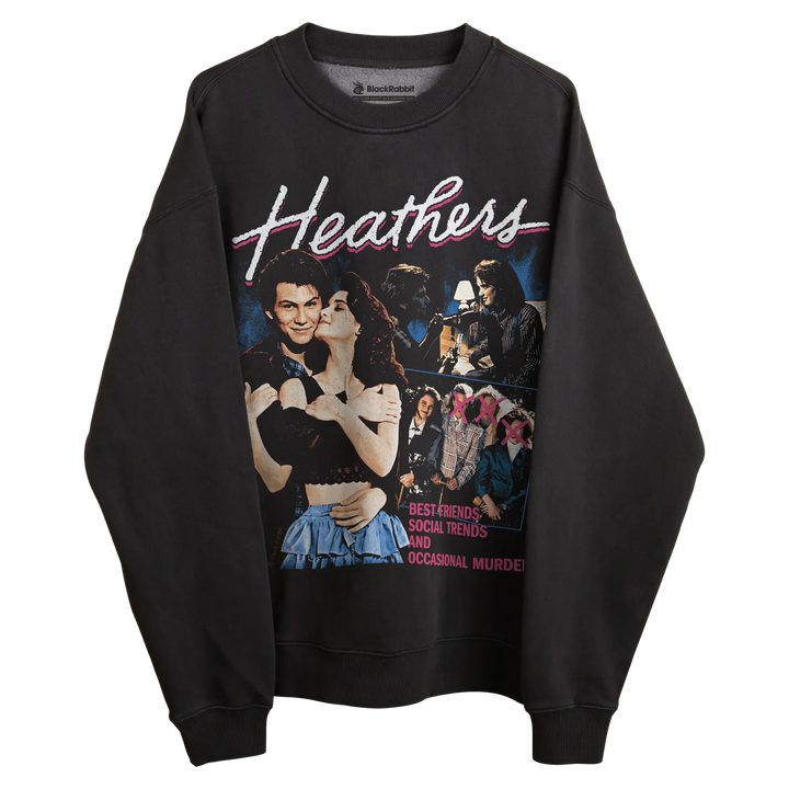 Black sweatshirt with ’heathers’ graphic design featuring characters and title in white, pink, blue, yellow, green, red.