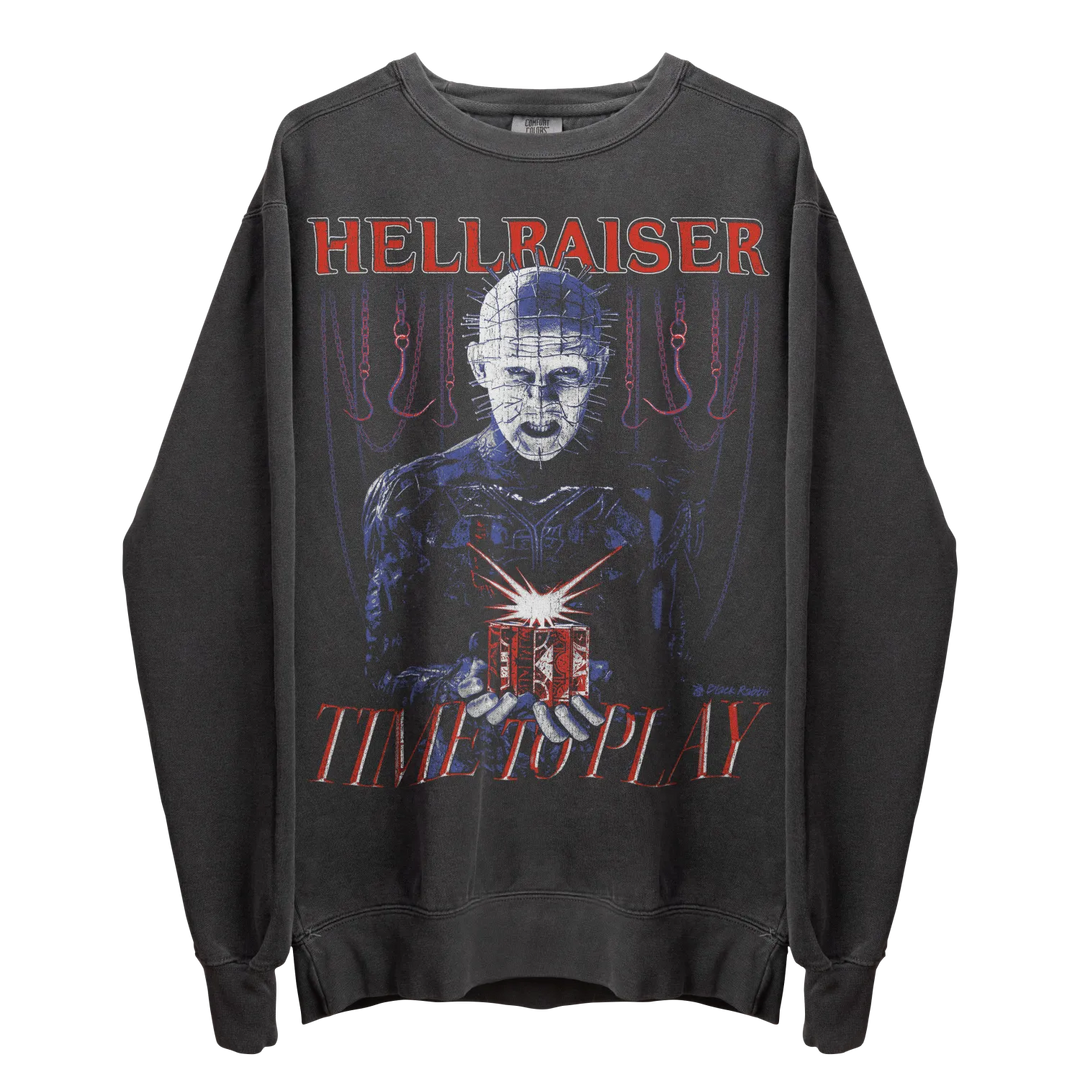 Dark grey long-sleeved sweatshirt with a graphic print of Pinhead from Hellraiser holding a puzzle box.