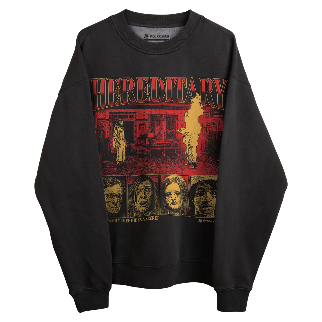 Black crewneck sweatshirt with ’hereditary’ graphic design featuring multiple faces and the title in red.