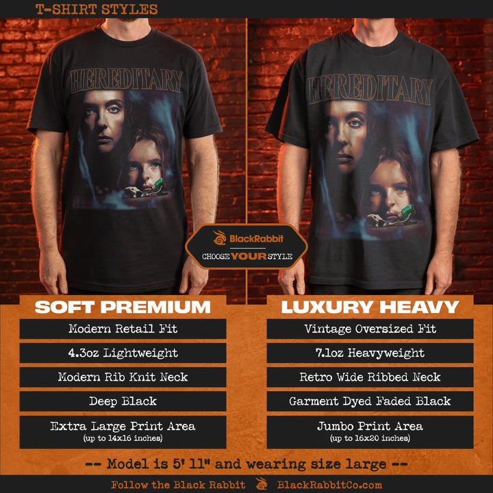 Two different styles of black t-shirts featuring the ’Hereditary’ movie poster.