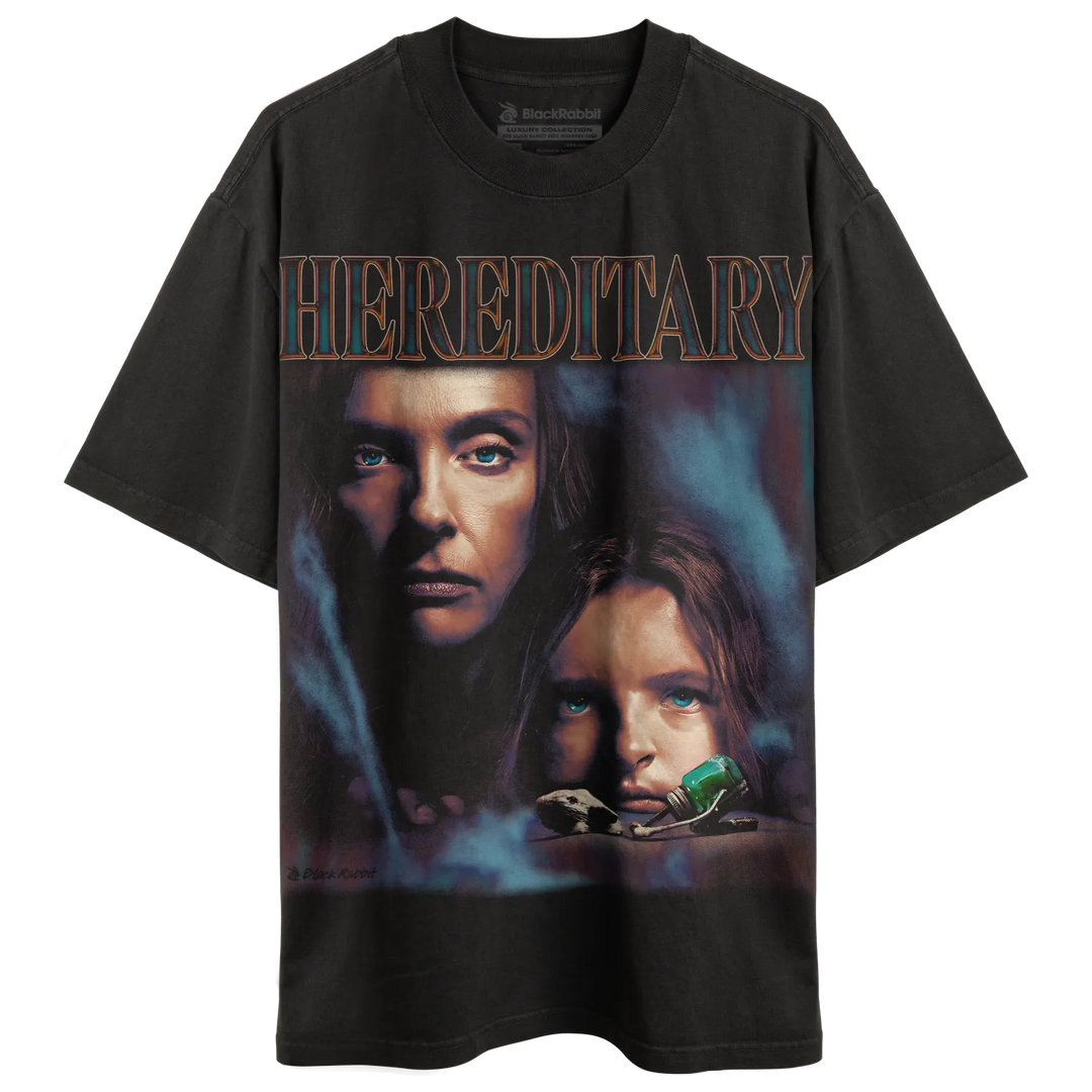 Dark gray t-shirt with a movie poster graphic of two women and the title ’HEREDITARY.’