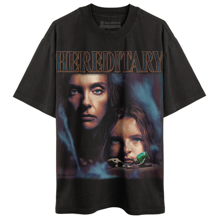 Dark gray t-shirt with a movie poster graphic of two women and the title ’HEREDITARY.’