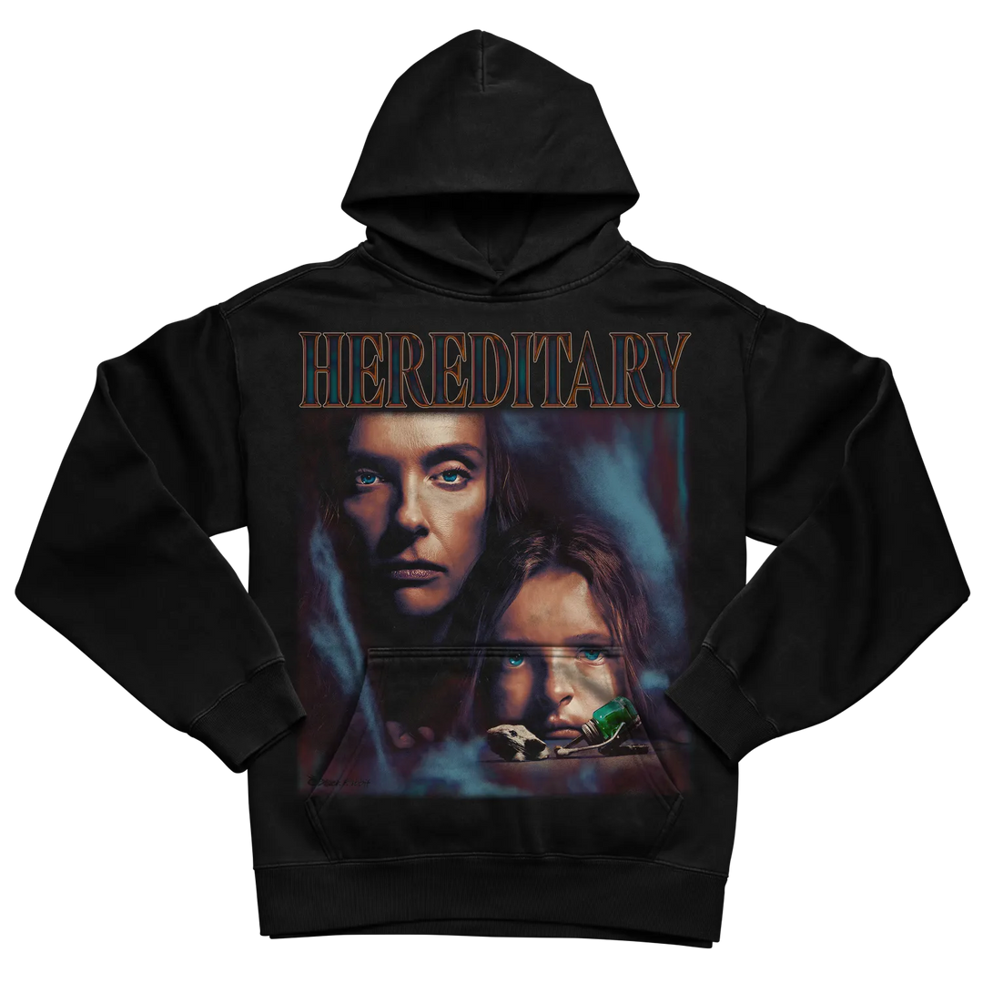 Black hoodie with ’hereditary’ design featuring two faces and the movie title in gold.