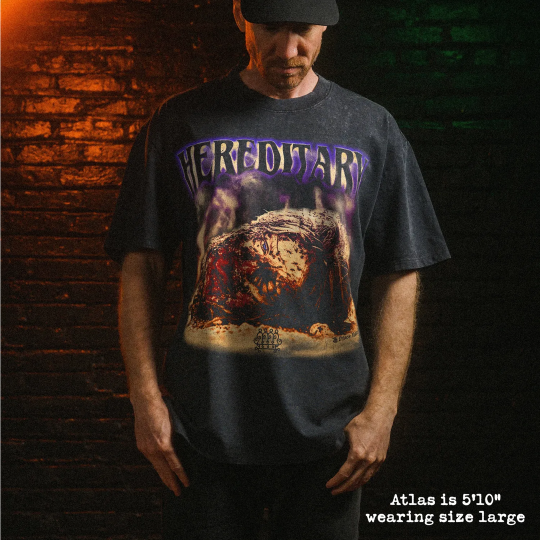 Male model wearing stone wash heavy tee with hereditary head graphic 