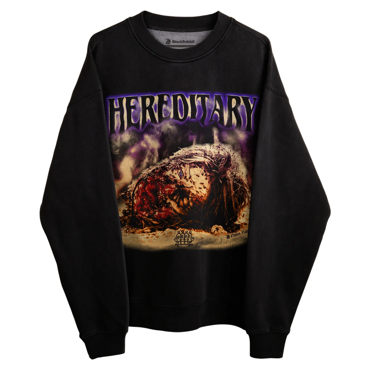 Black crewneck sweatshirt with ’hereditary’ graphic design featuring a horror movie poster print.