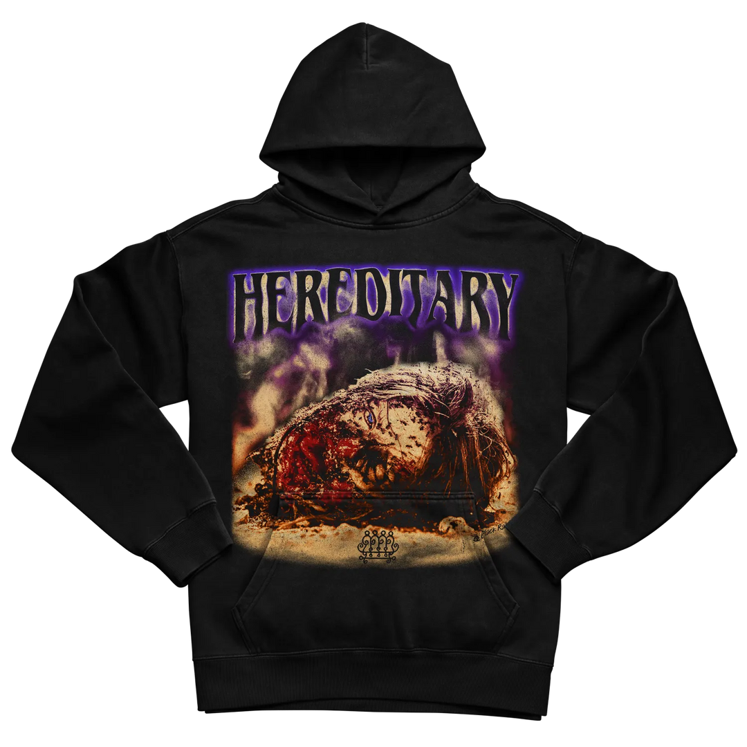 Black hoodie with ’hereditary’ graphic design featuring a horror-themed image of an eye.