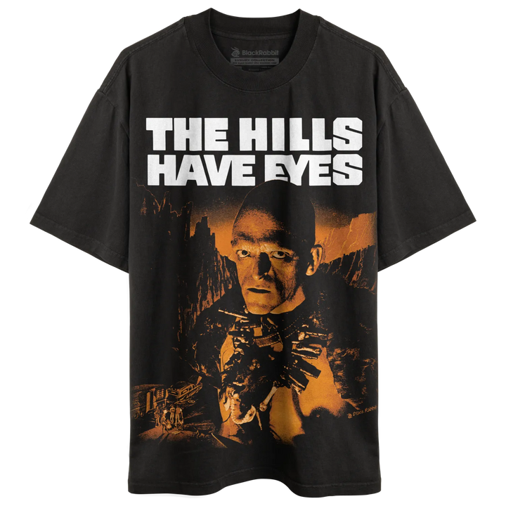 Black t-shirt with ’the hills have eyes’ graphic design featuring a man holding guns.