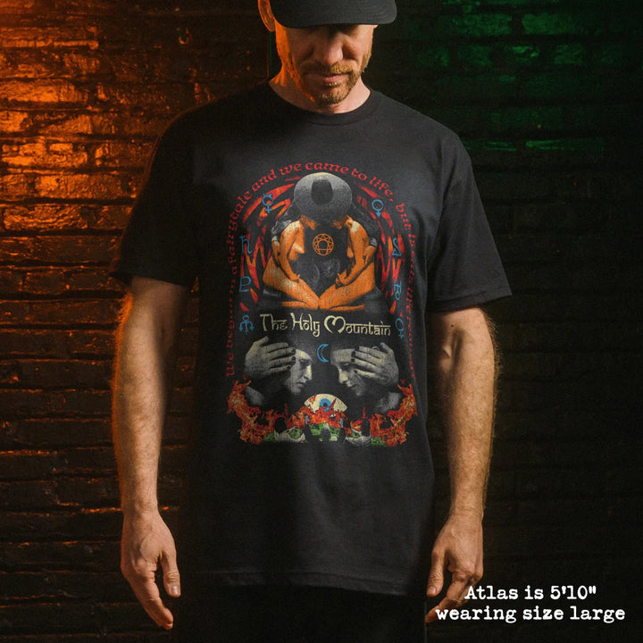 Male model wear soft premium tee with holy mountain graphic
