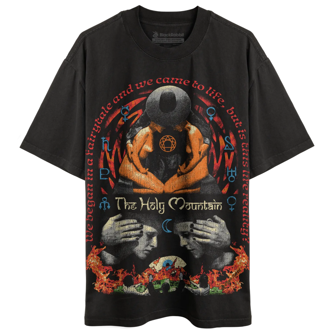 Black graphic tee with flame design and text ’the holy mountain’