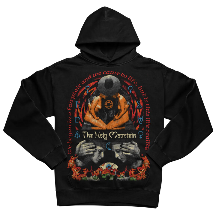 Black hoodie with graphic design of hands holding a skull and flames, featuring ’the holy mountain’ text.
