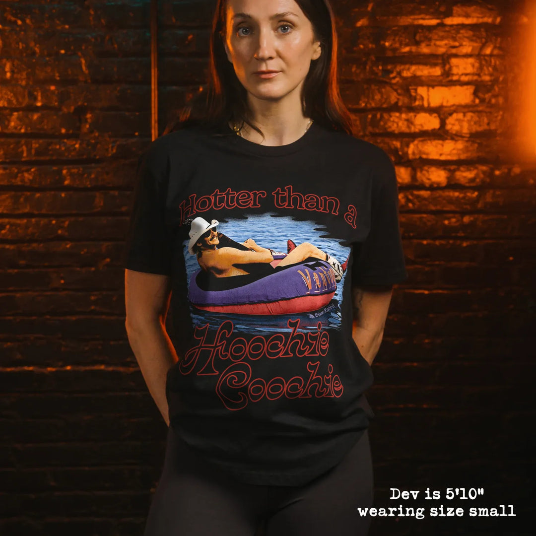Model wearing black t-shirt with hoochi graphic
