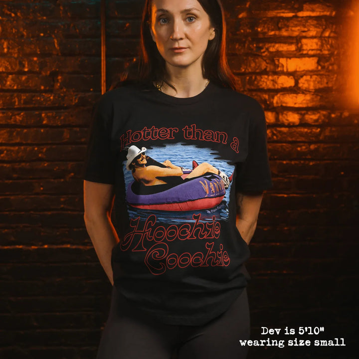 Model wearing black t-shirt with hoochi graphic
